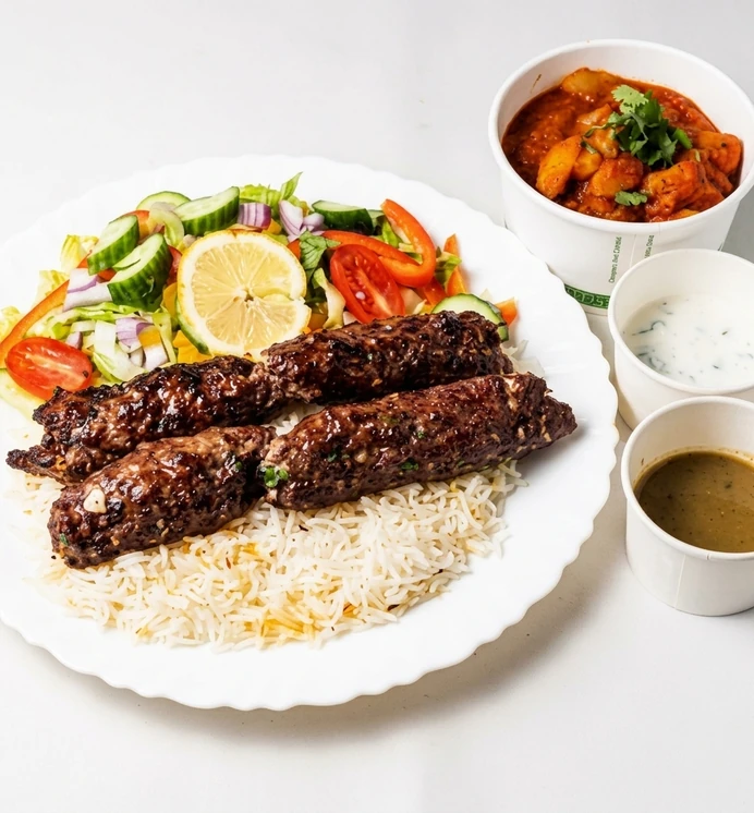 Two skewers of charcoal grilled ground beef kebab at Papa Nash's in Airdrie, AB